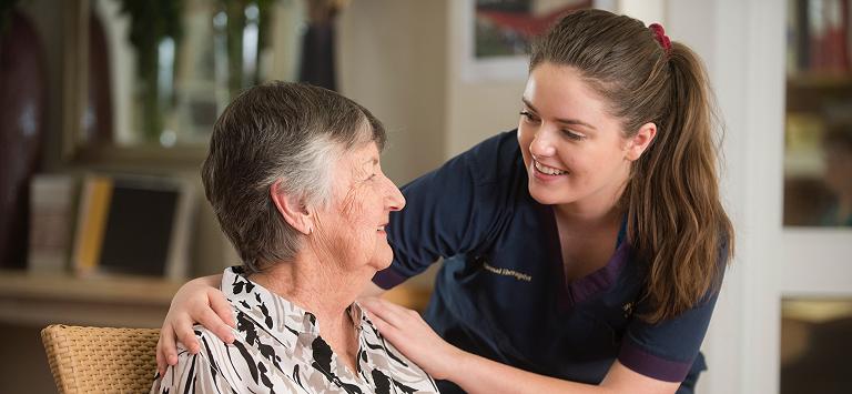 Therapy staff member with resident